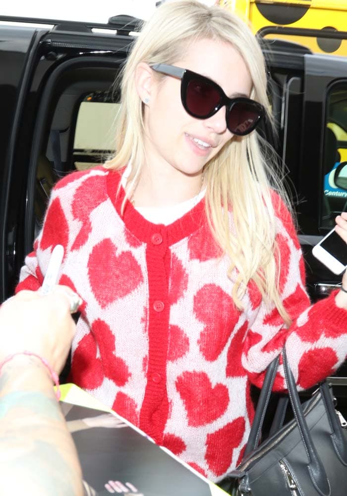 Emma Roberts arrives for a departure at Los Angeles International Airport