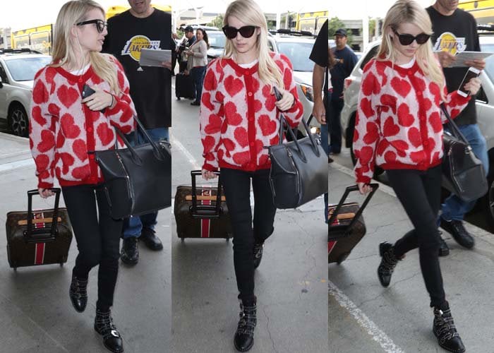 Emma Roberts wears a heart-print Ivana Helsinki cardigan during her recent stroll through LAX