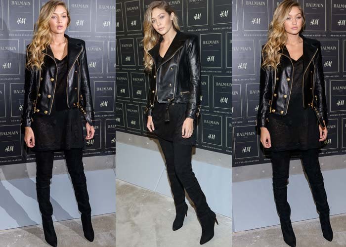 Gigi Hadid poses for photos at the H&M x Balmain launch in an all-black outfit