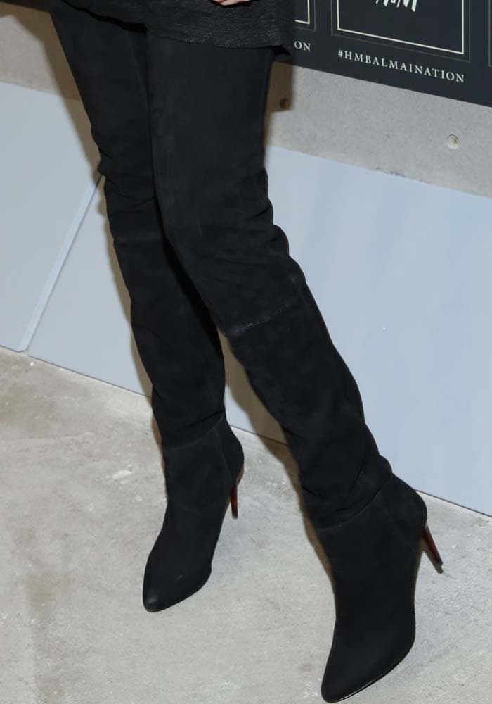 Gigi Hadid covers her feet and legs with suede H&M x Balmain over-the-knee boots
