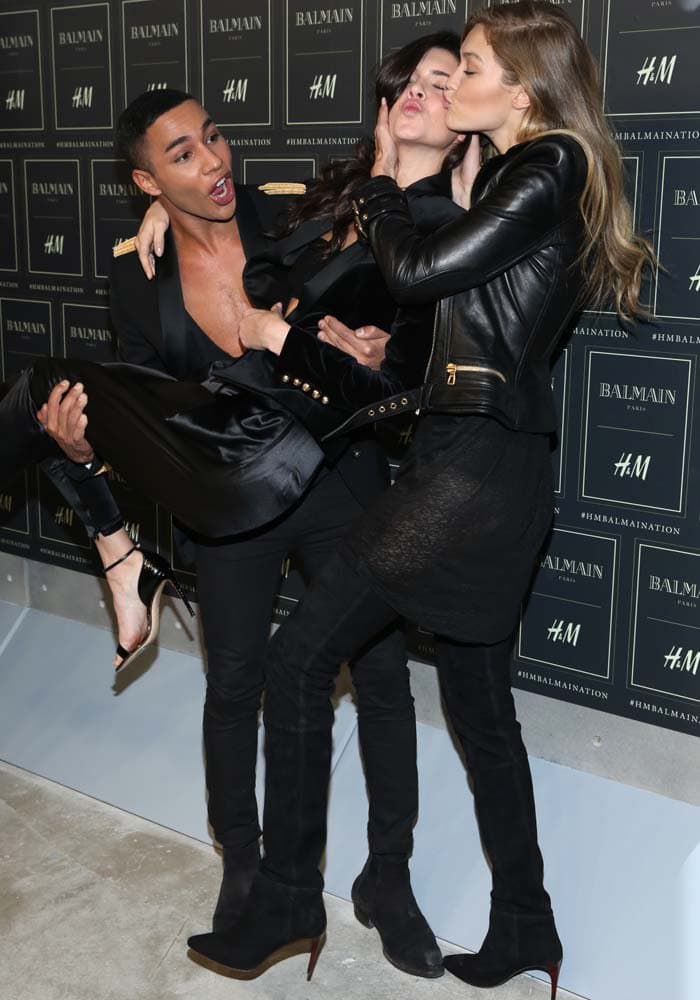 Gigi Hadid and Kendall Jenner joke around with Creative Director for Balmain Olivier Rousteing