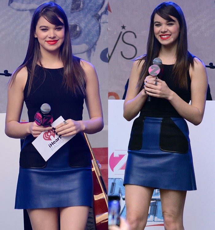 Hailee Steinfeld holds a microphone and smiles at a Z100 event