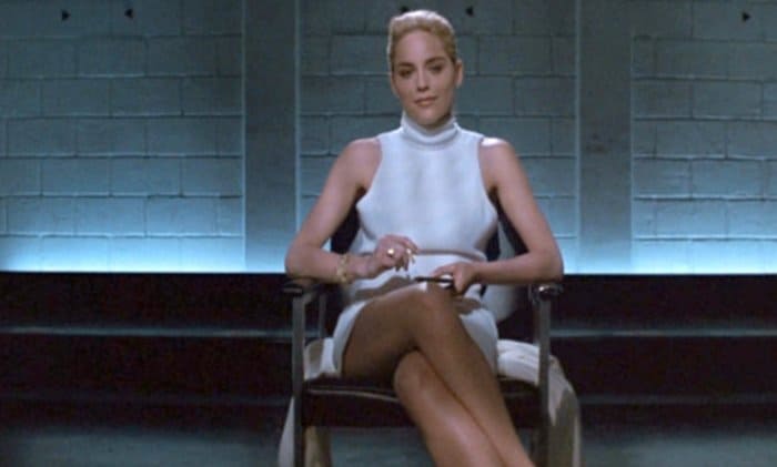 Sharon Stone in a sexy white dress while interrogated by cops