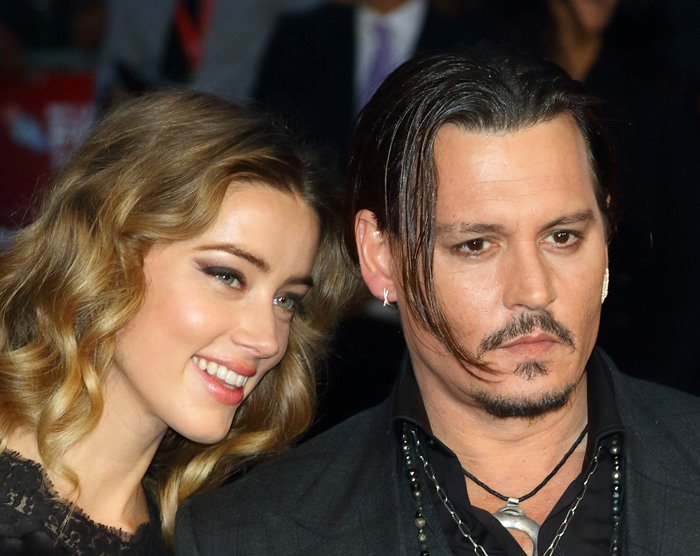 Amber Heard and Johnny Depp attend the premiere of "Black Mass"