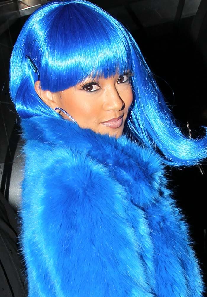 Karrueche Tran donned a bold blue costume inspired by Lil' Kim