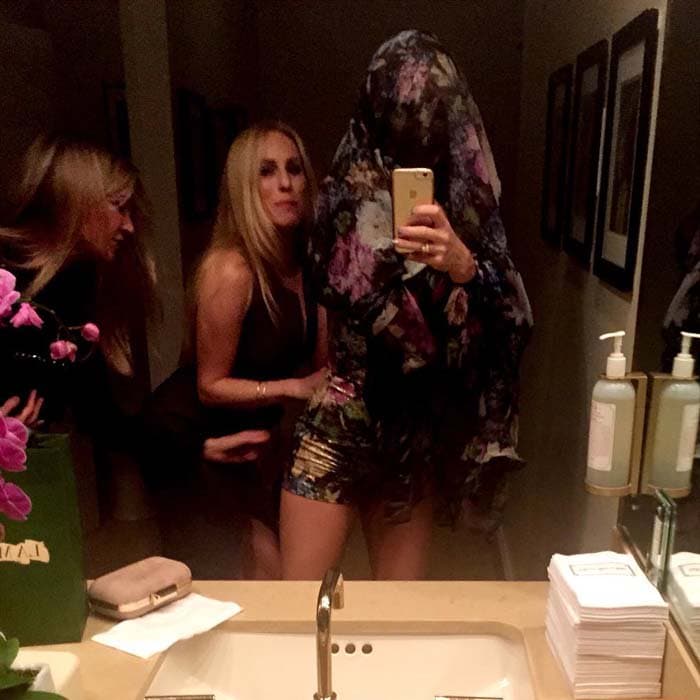 Kate Hudson uploads a hilarious photo as she attempts to use the bathroom while wearing a Yanina Couture gown
