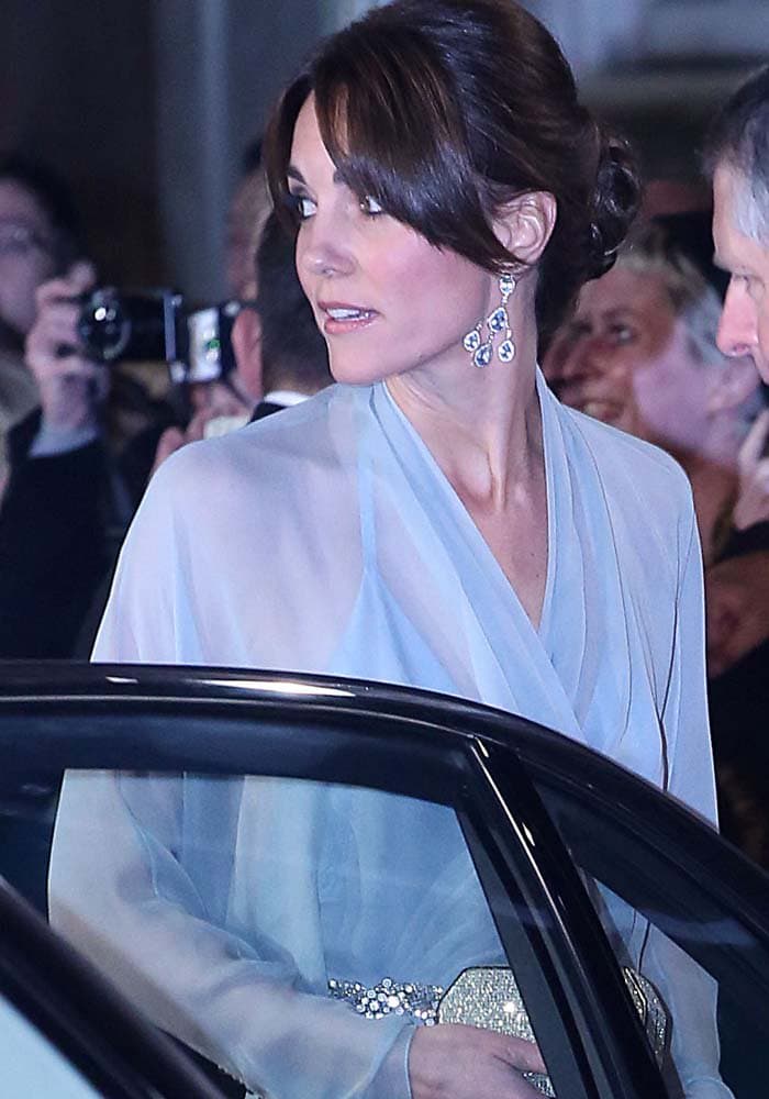 Kate Middleton coordinates her sparkly Jenny Packham clutch with the belt detailing on her dress