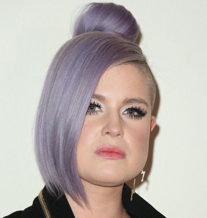 Kelly Osbourne made a striking statement with her daring and unconventional purple side-shaved top bun during Cosmopolitan’s 50th Birthday Celebration