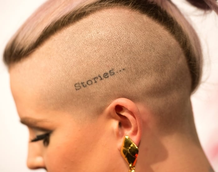 Kelly Osbourne has ‘Stories…’ tattooed on the left side of her scalp