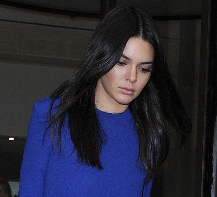 Kendall Jenner in a long-sleeve top from Solace London leaves her London hotel