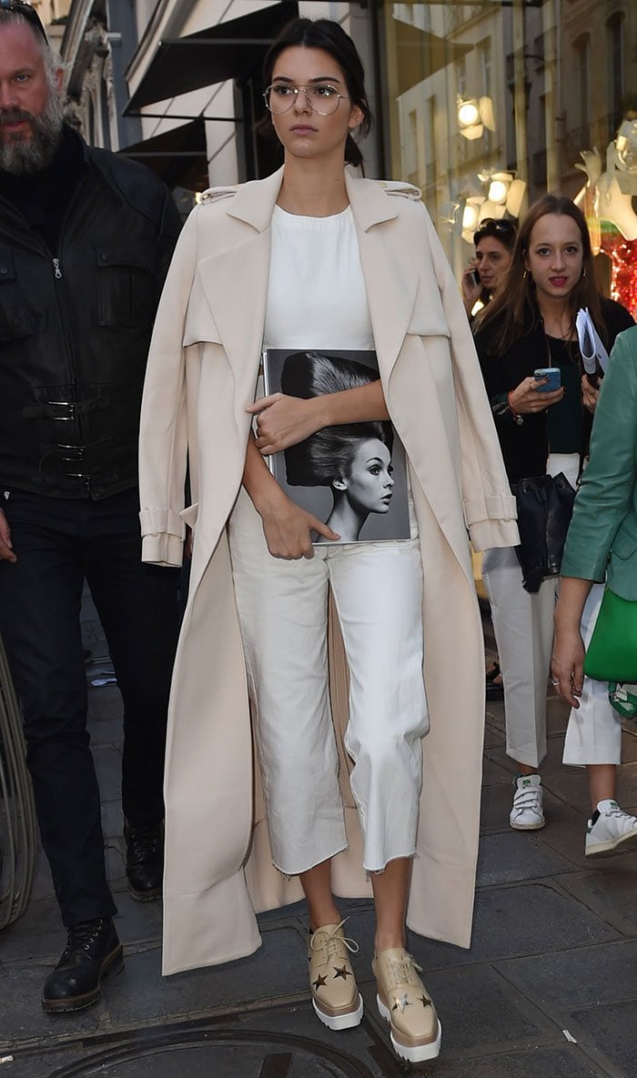 Kendall Jenner wearing Garrett Leight glasses and a white Asos jumpsuit