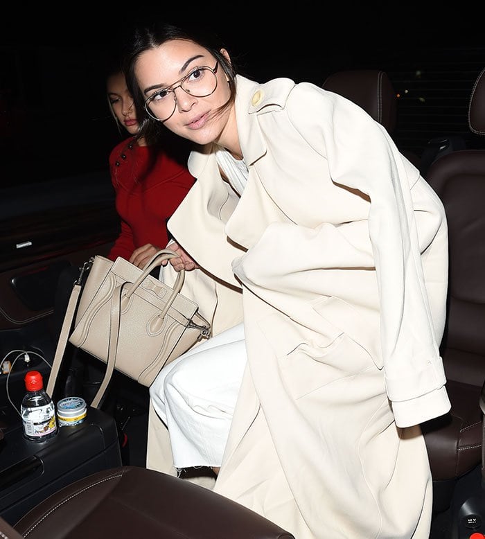 Kendall Jenner styled her hair in a loose ponytail before leaving the Colette bookstore