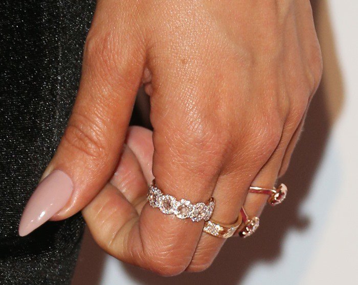 Khloé Kardashian shows off her neutral-toned manicure and a selection of rings