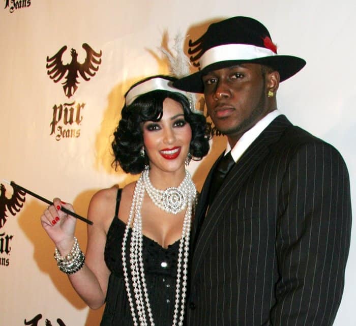 Kim Kardashian and Reggie Bush dressed as a Flapper and a Mobster
