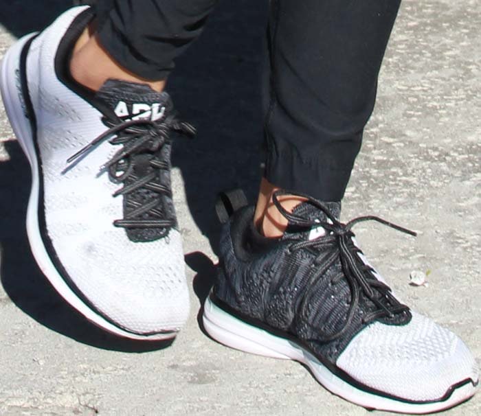 Kourtney Kardashian's feet in APL TechLoom sneakers