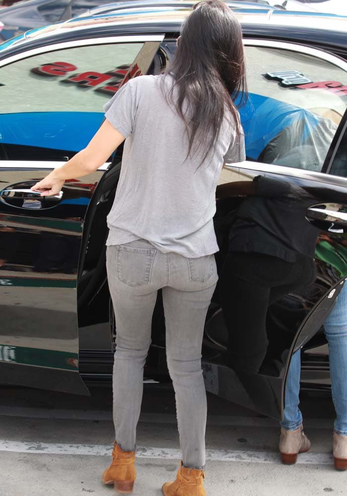 Kourtney Kardashian wears a pair of J Brand jeans to pick up her family members