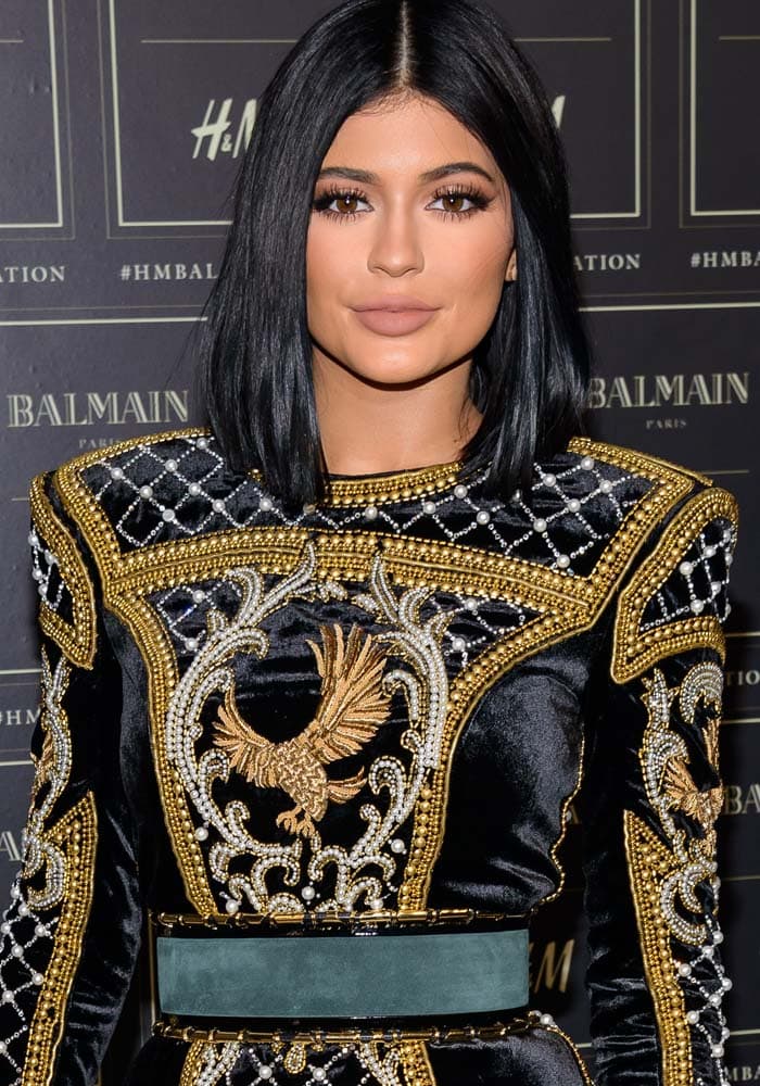 Kylie Jenner wore her hair with a center part at the Balmain x H&M collection launch