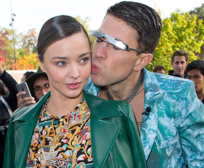 Vitalii Sediuk assaults Miranda Kerr with a kiss at the Louis Vuitton show held during Paris Fashion Week