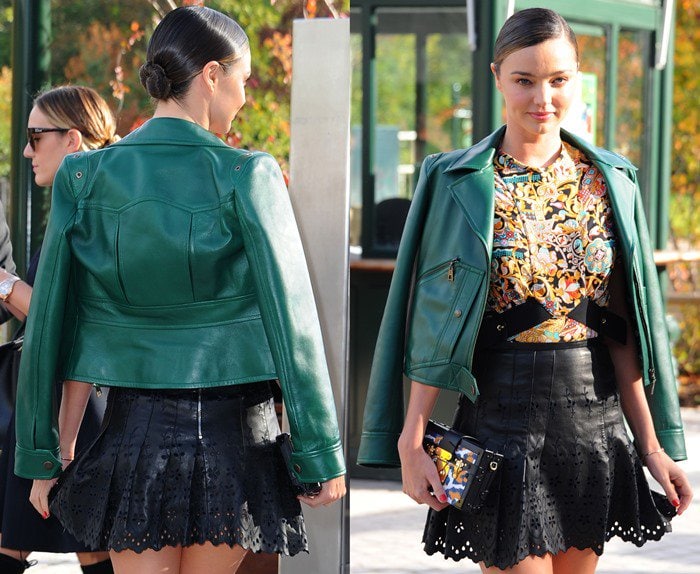 Miranda Kerr shows off her Louis Vuitton outfit as she attends Paris Fashion Week