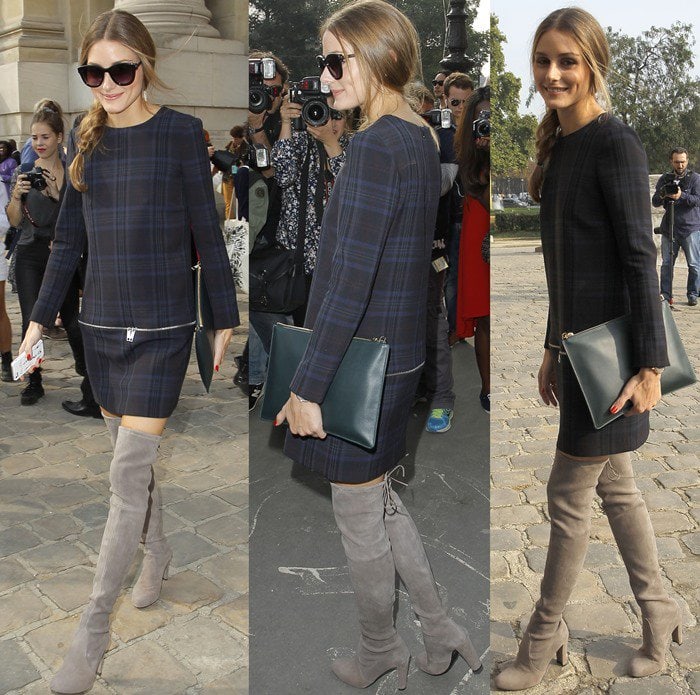 Olivia Palermo caps off her structured outfit with gray suede over-the-knee boots