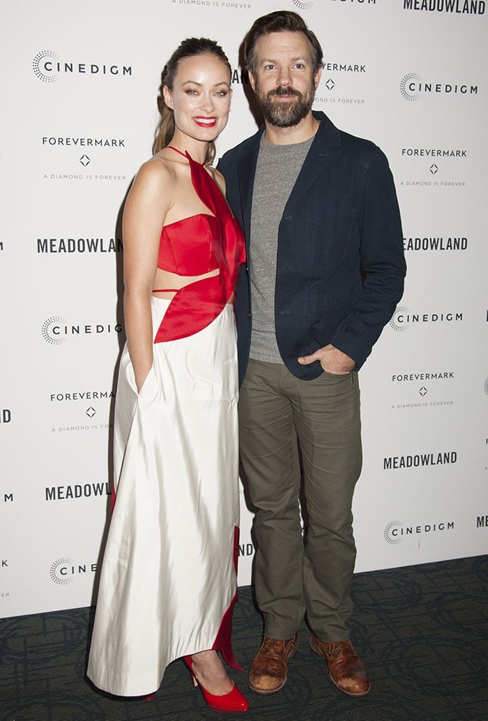 Olivia Wilde poses on the red carpet with fiancé Jason Sudeikis at a special screening of "Meadowland"