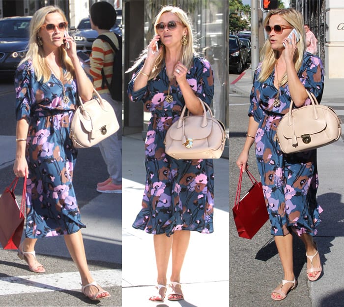 Reese Witherspoon shopping on Rodeo wearing a blue floral dress in California