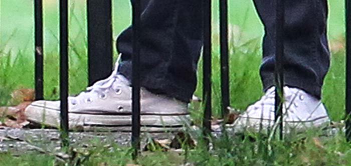 Renée Zellweger finishes her on-camera outfit with a pair of Converse sneakers on her feet
