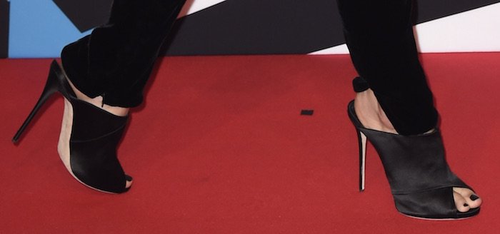 Ruby Rose finishes her red carpet look with a pair of Giuseppe Zanotti satin mules