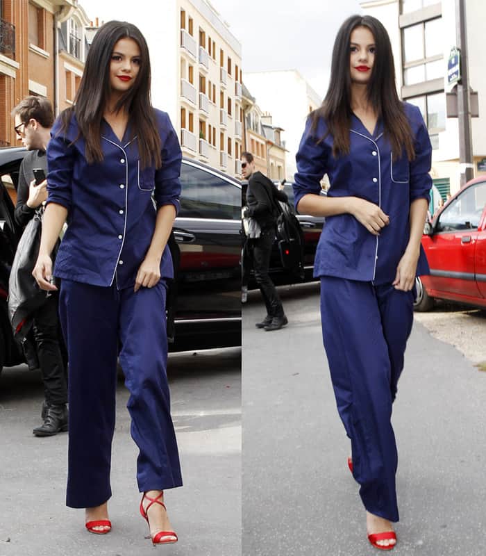 Selena Gomez wears a Derek Rose Lombard pajama set and red Brian Atwood Tamy sandals