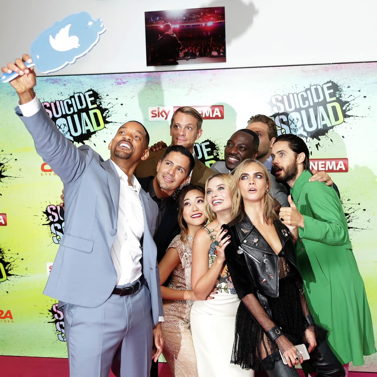 Will Smith poses for a selfie with Jay Hernandez, Joel Kinnaman, Adewale Akinnuoye-Agbaje, Jai Courtney, Jared Leto, Cara Delevingne, Margot Robbie, and Karen Fukuhara at the European Premiere of "Suicide Squad"