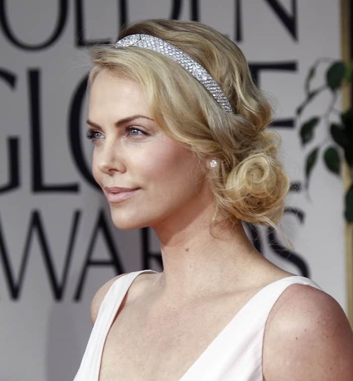 Charlize Theron wears a fashion crown at the 69th Annual Golden Globe Awards