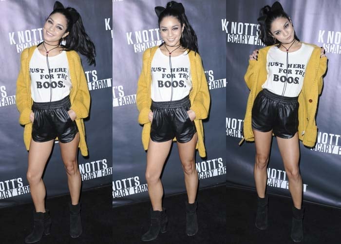 Vanessa Hudgens flips her hair around and poses on the black carpet at a Los Angeles haunted house promotional event