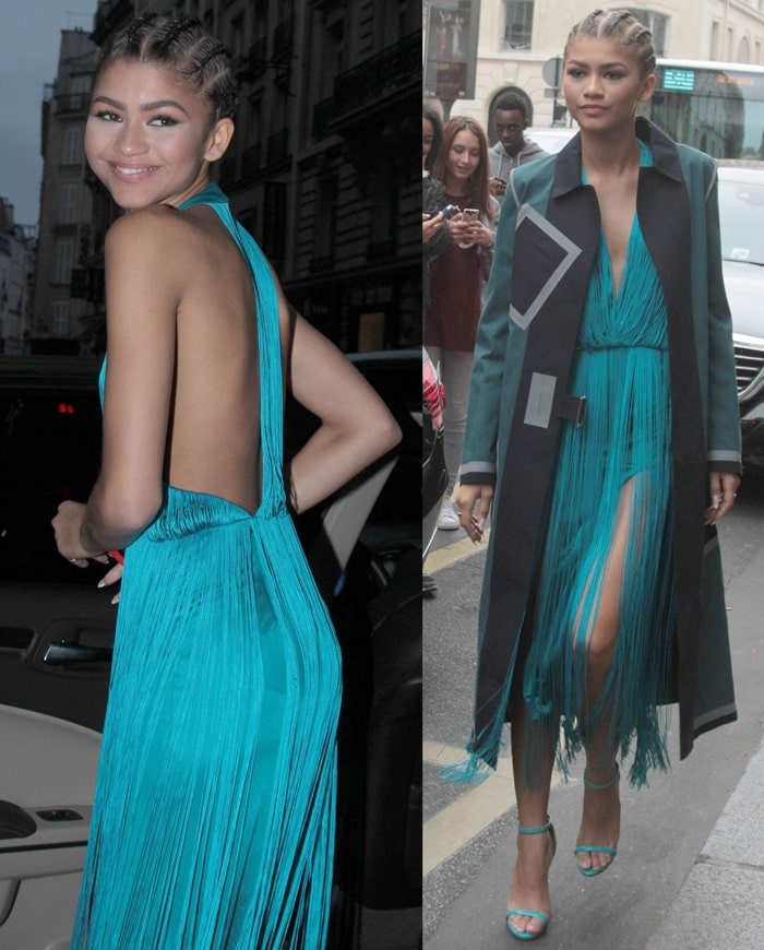 Zendaya flashes a smile while wearing a pair of Ruthie Davis sandals on her feet in France