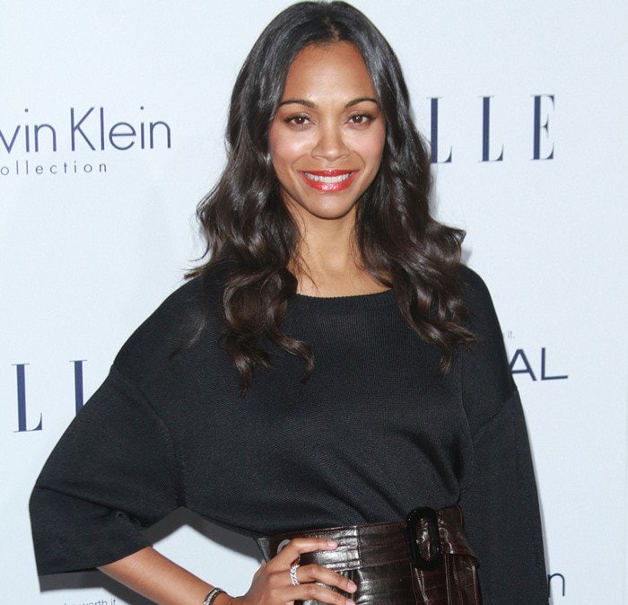 Zoe Saldana wears her dark hair long as she poses for photos