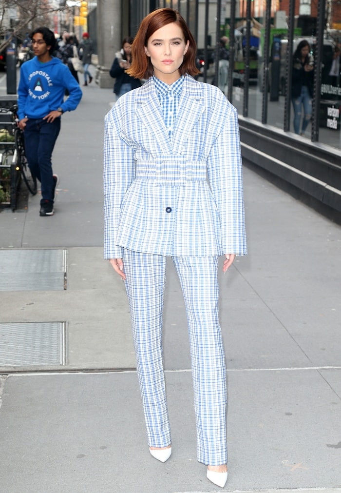 Zoey Deutch wears a plaid suit for an interview at the Build Series