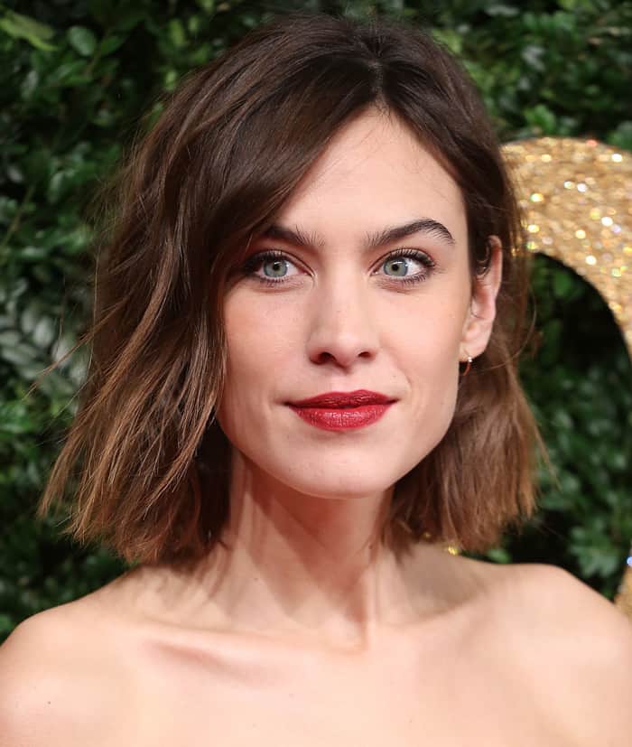 Alexa Chung's sleek bob and bold red lips perfectly complemented her vintage-inspired look at the 2015 British Fashion Awards