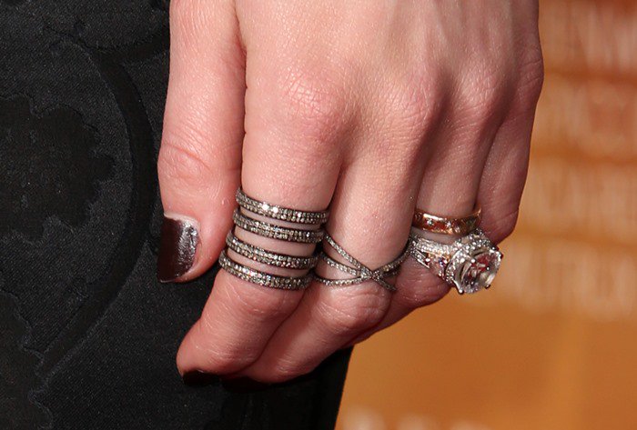 Amber Heard accessorized with a variety of rings