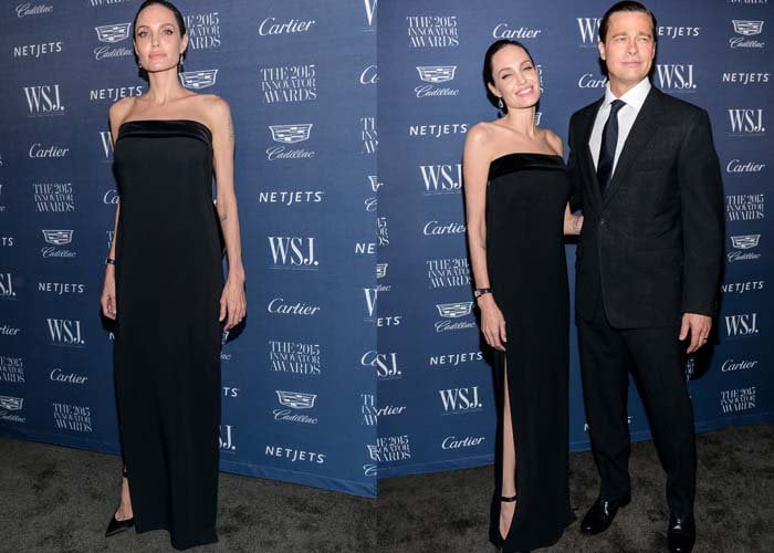 Angelina Jolie wears her hair back as she poses on the black carpet in a Tom Ford gown