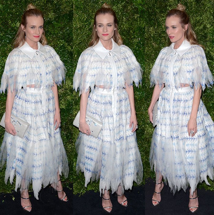 Diane Kruger carries a Chanel clutch on the black carpet