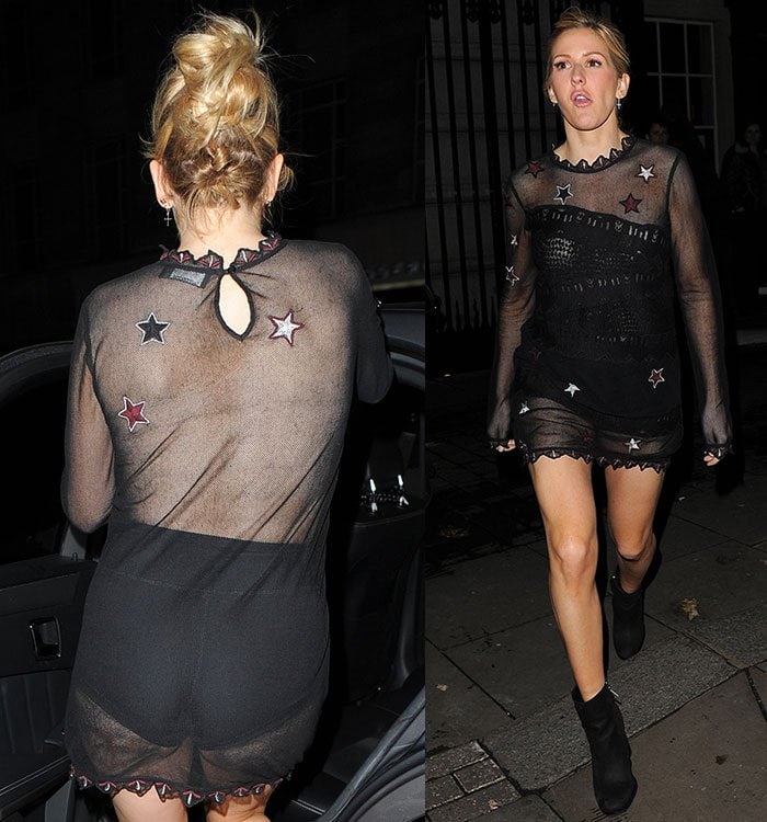 Ellie Goulding wears a pair of short black shorts under a sheer black star-embroidered mini dress