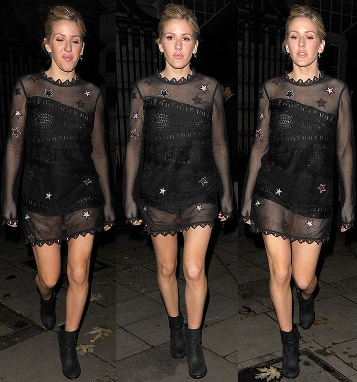 Ellie Goulding wears a pair of black booties with her sheer mini dress