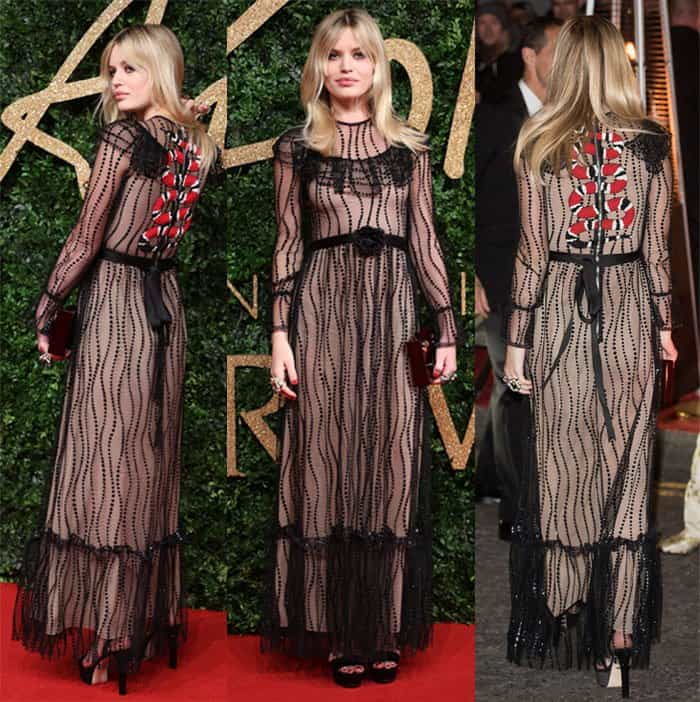 Georgia May Jagger turned heads in a Gucci S/S 2016 gauzy gown featuring a striking red floral detail on the back at the 2015 British Fashion Awards