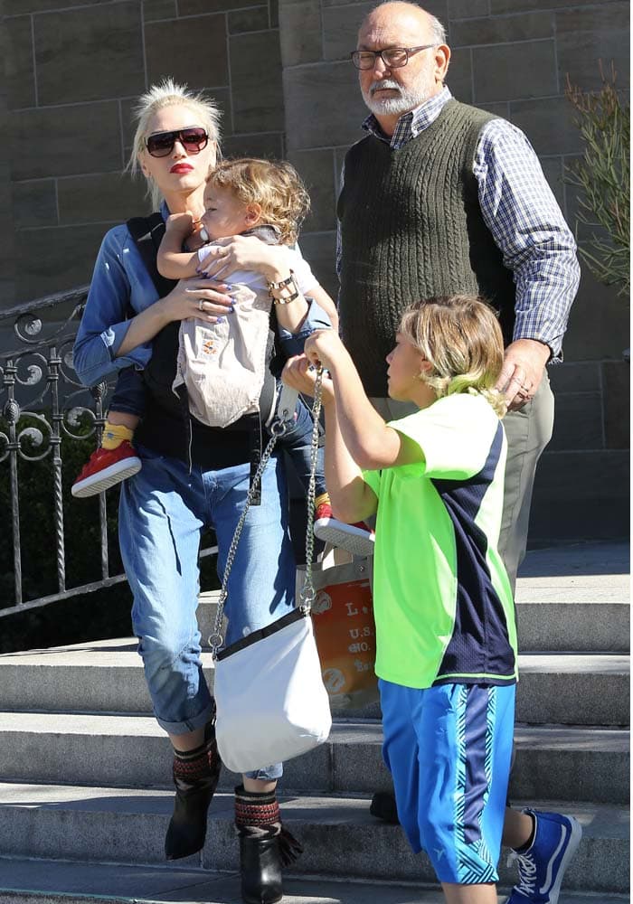 Joined by her father Dennis Stefani, Gwen Stefani takes her three boys, Kingston, Zuma, and Apollo, to Sunday mass at a local churc