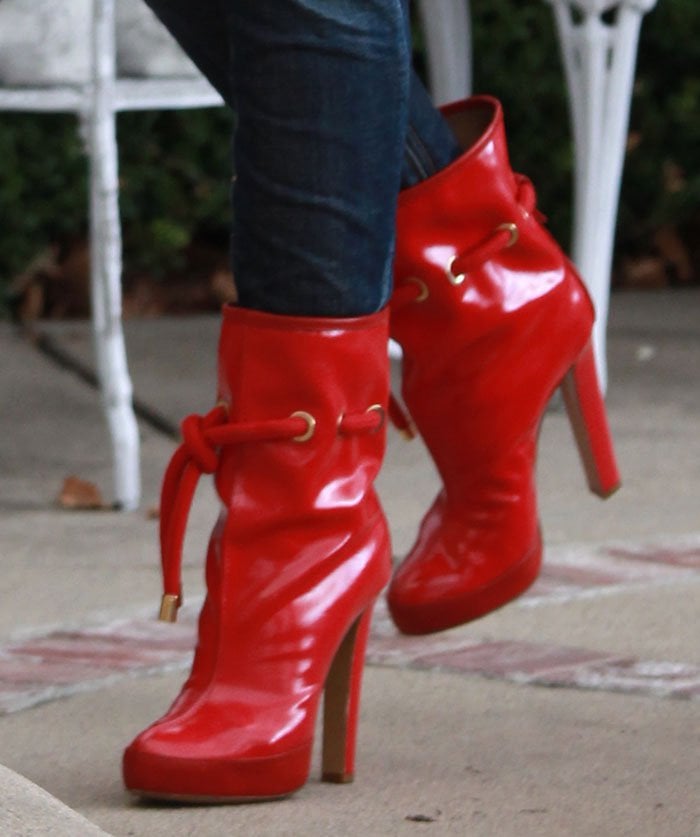 Gwen Stefani in glossy red DSquared2 boots