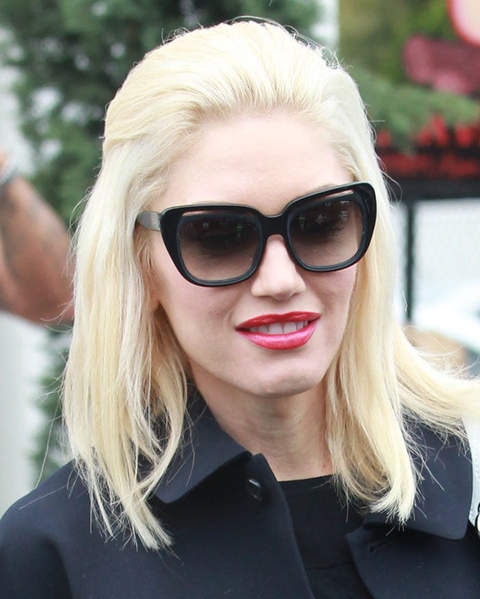 Gwen Stefani wears her blonde hair down during an outing with her children