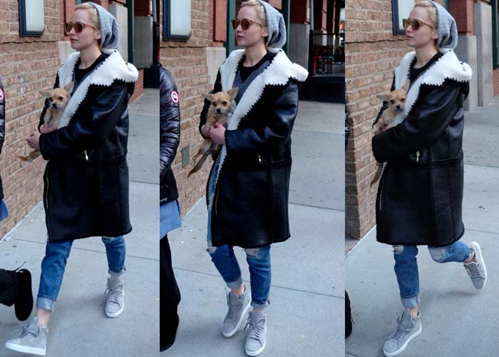 Jennifer Lawrence steps out in Manhattan wearing an oversized coat and ripped jeans