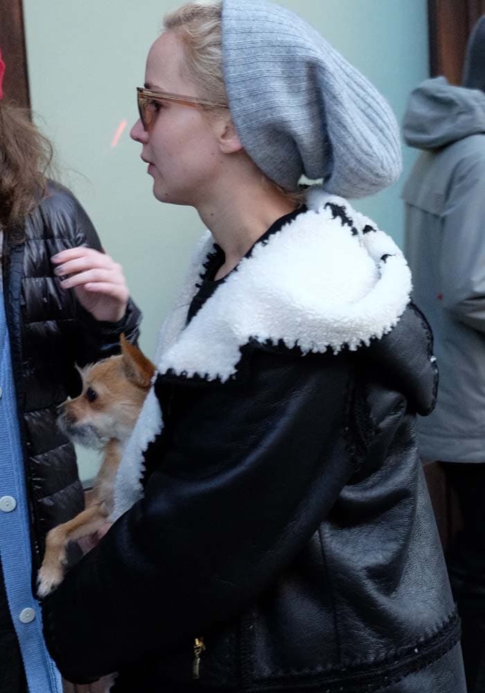 Jennifer Lawrence holds her dog Pippa while out for a walk in New York City