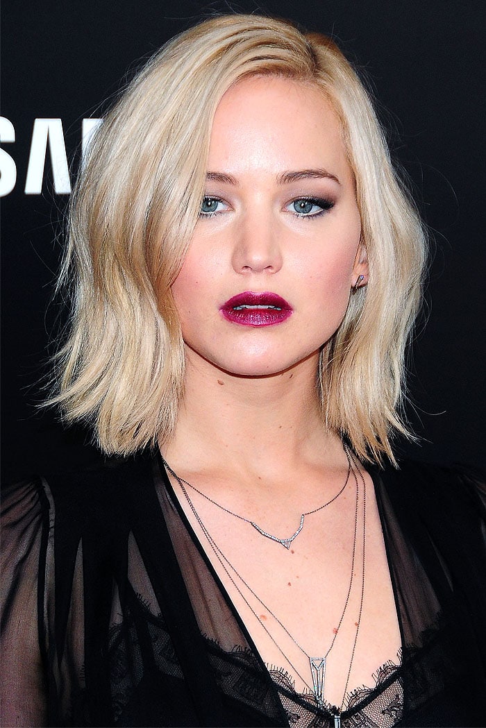 Jennifer Lawrence wearing earrings and layered necklaces from Eva Fehren