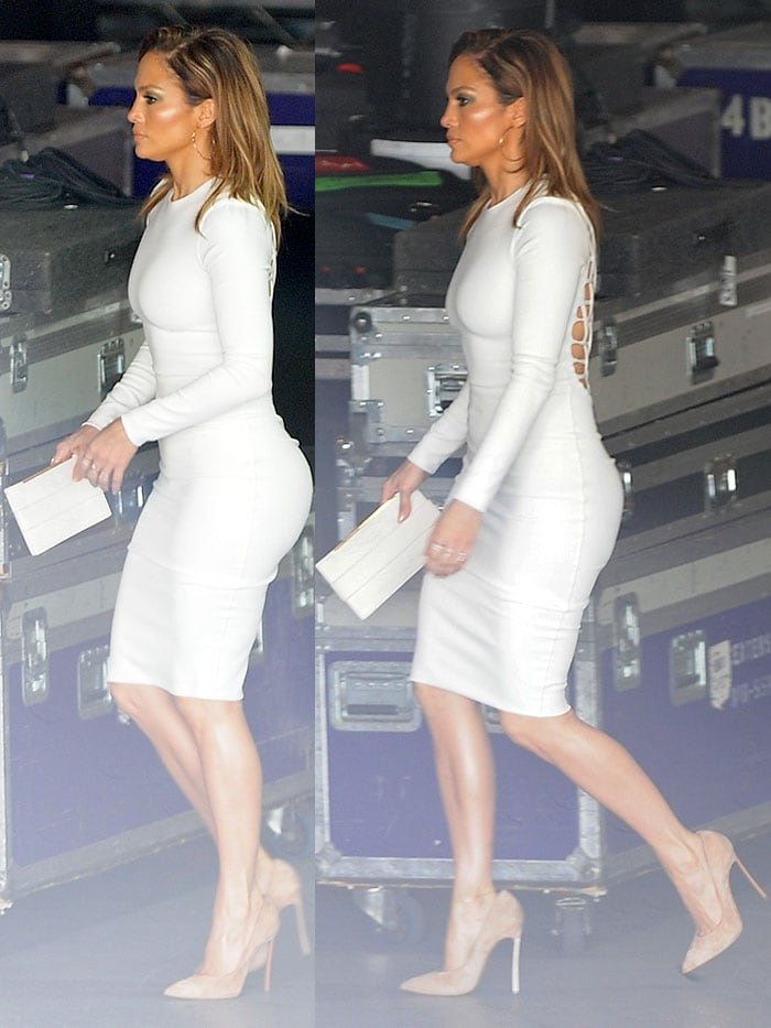 Showing the Kardashians what the original looks like, JLo flaunted her booty in a tight white dress