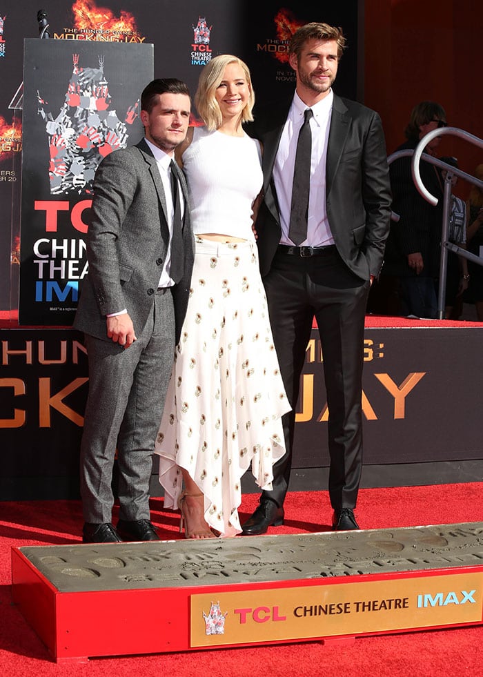 Josh Hutcherson, Jennifer Lawrence, and Liam Hemsworth at "The Hunger Games: Mockingjay — Part 2" cast hand and footprint ceremony in Los Angeles